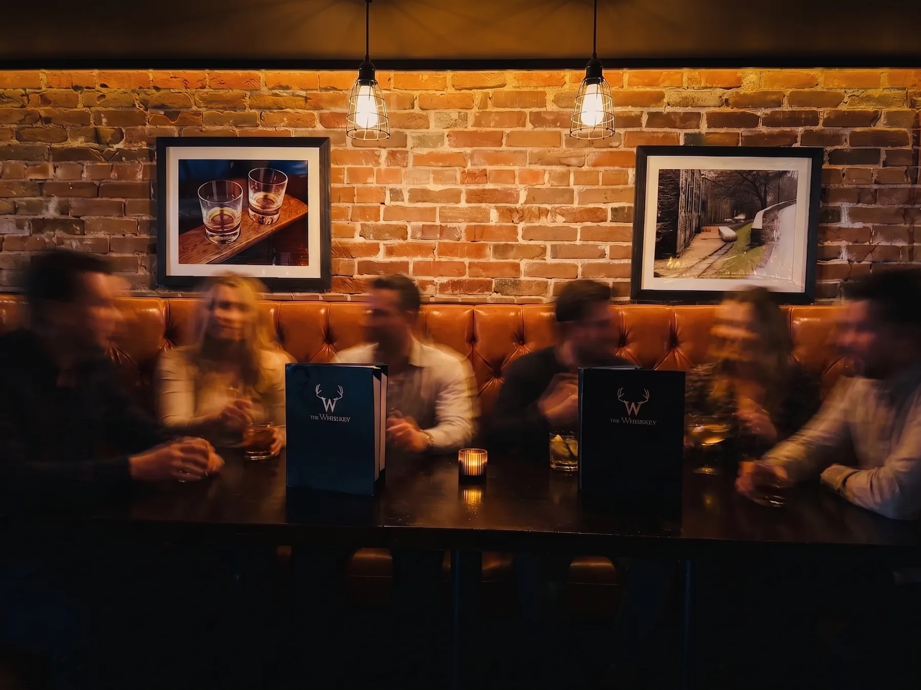 Leather booths under pendant lights