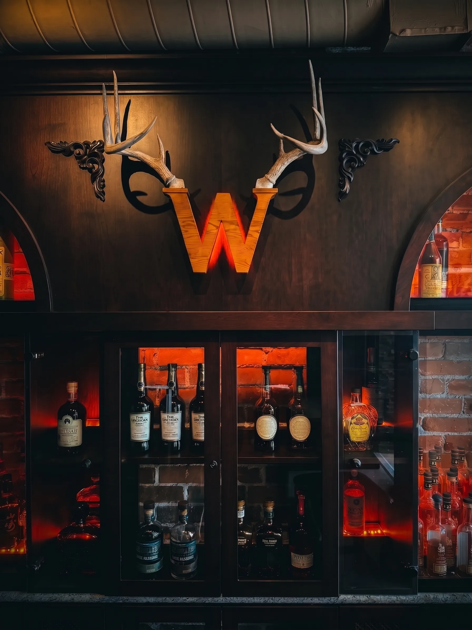 The official Whisk(e)y antler W over the back bar