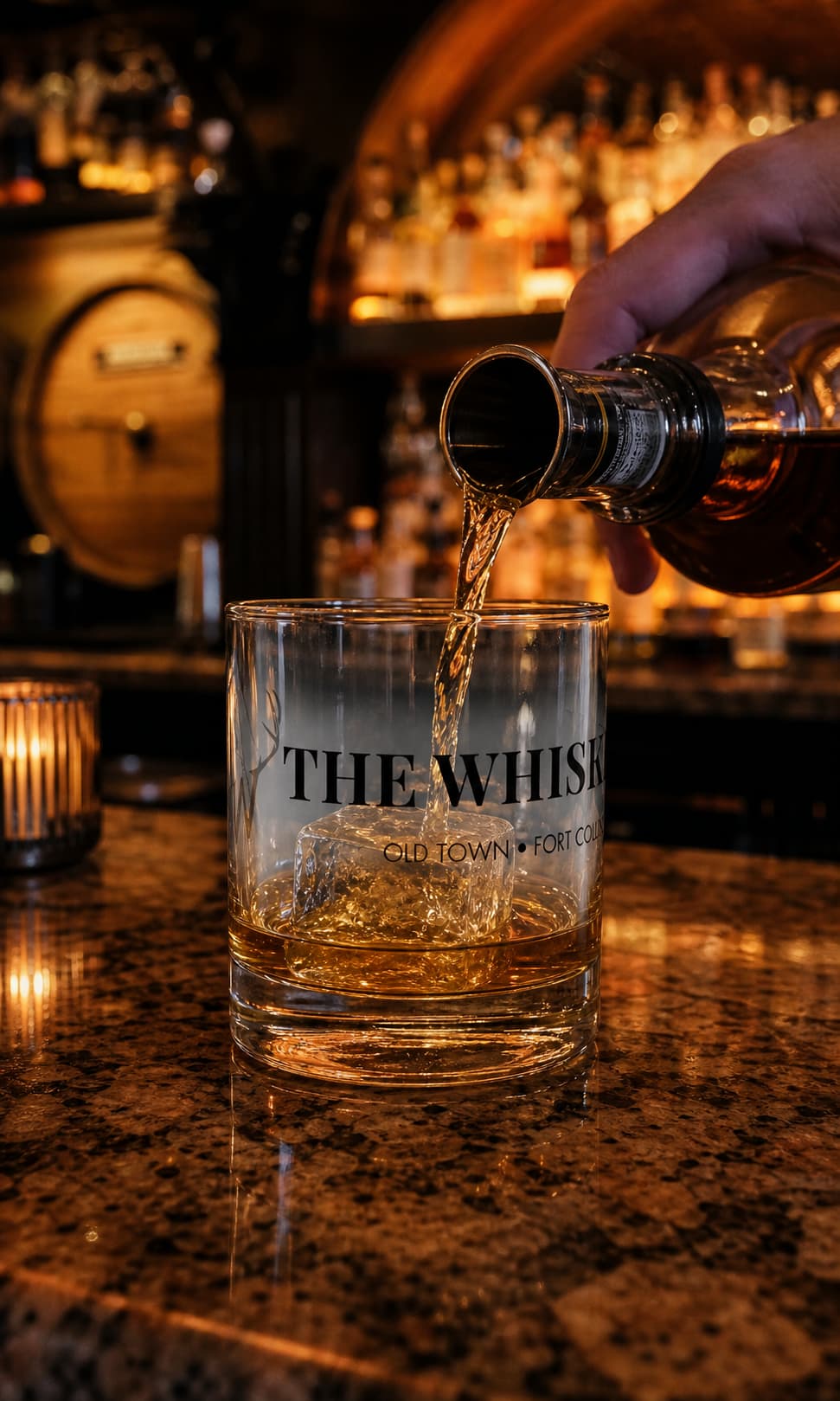 The Backbar Rocks Glass during an amber pour at the bar